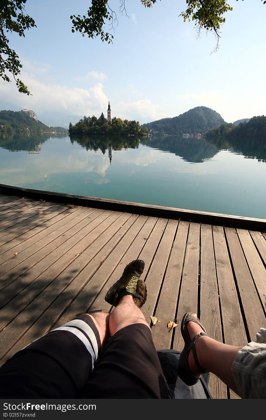 Two people relaxing on a beautiful lake in Slovenia. Two people relaxing on a beautiful lake in Slovenia