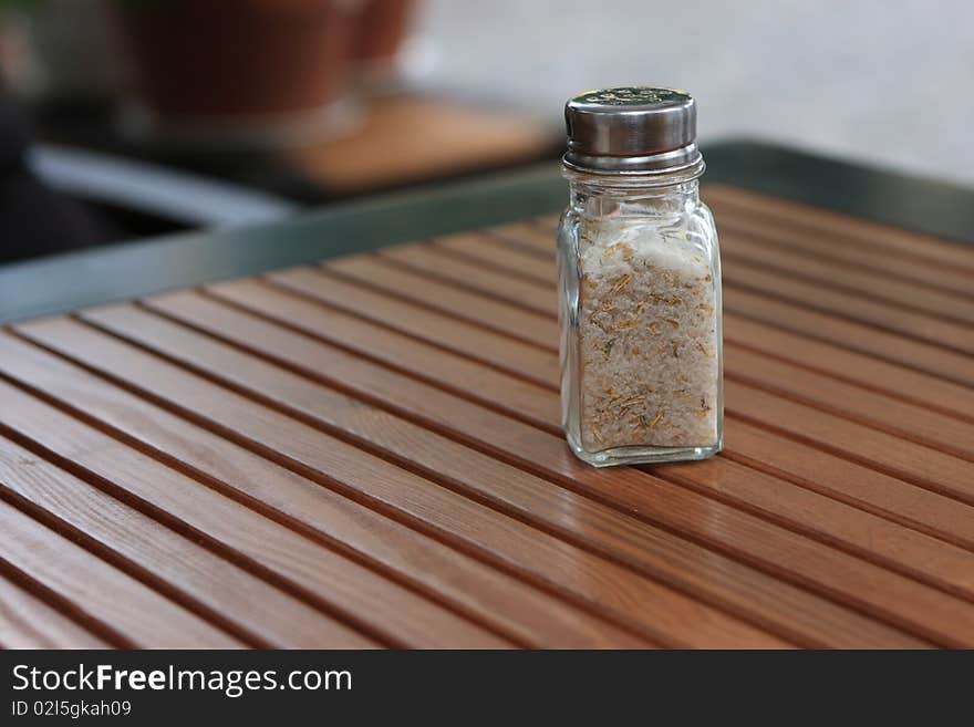 Salt Shaker On Wooden Table