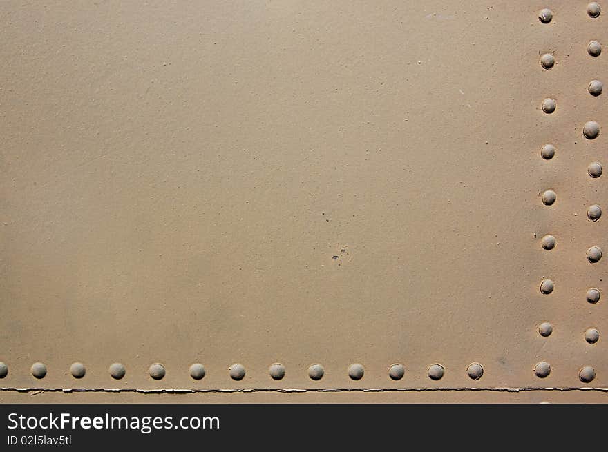 The riveted covering of a fuselage of the old military plane. The riveted covering of a fuselage of the old military plane.