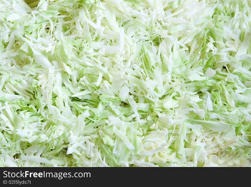 Sliced cabbage green abstract background, horizontal closeup. Sliced cabbage green abstract background, horizontal closeup