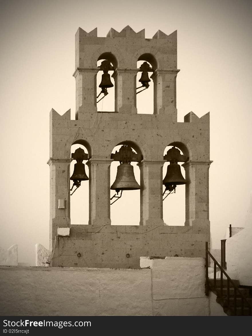 Traditional orthodox Greek Belfry found in most islands of Greece. Note:  Some grain added on purpose