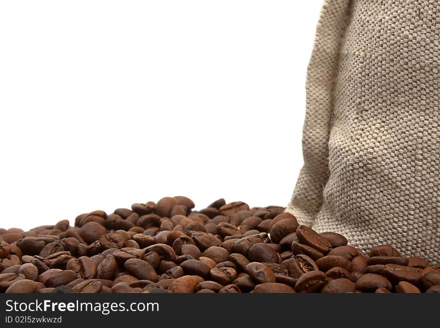 Coffee beans and burlap sack isolated on white