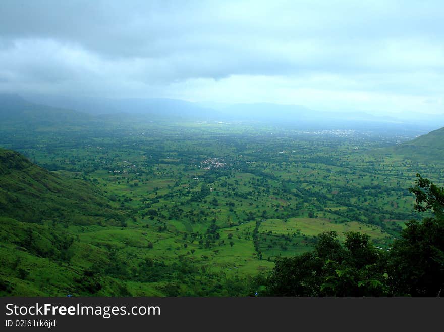 An exotic and beautiful scene of a distant Indian village in the season of monsoon. An exotic and beautiful scene of a distant Indian village in the season of monsoon.