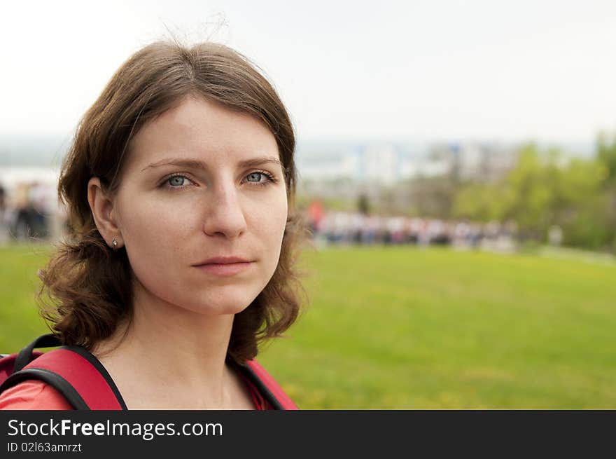 In a photo the girl against a landscape