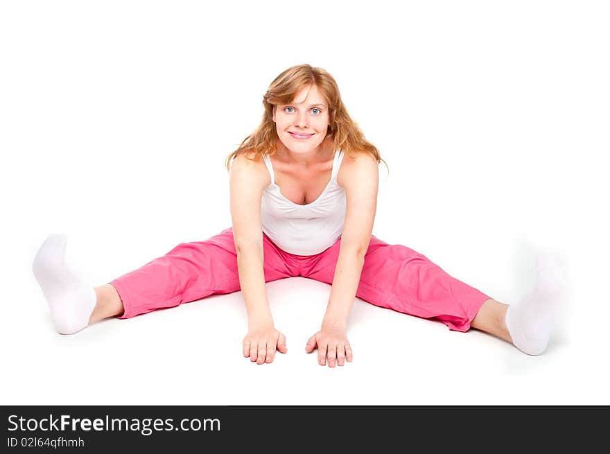 Pregnant woman making fitness exercises isolated over white