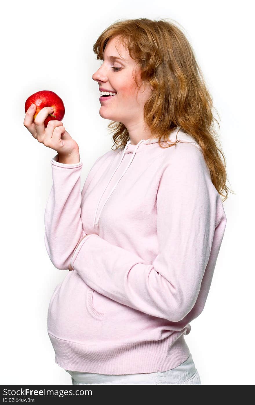 Pregnant woman with apple