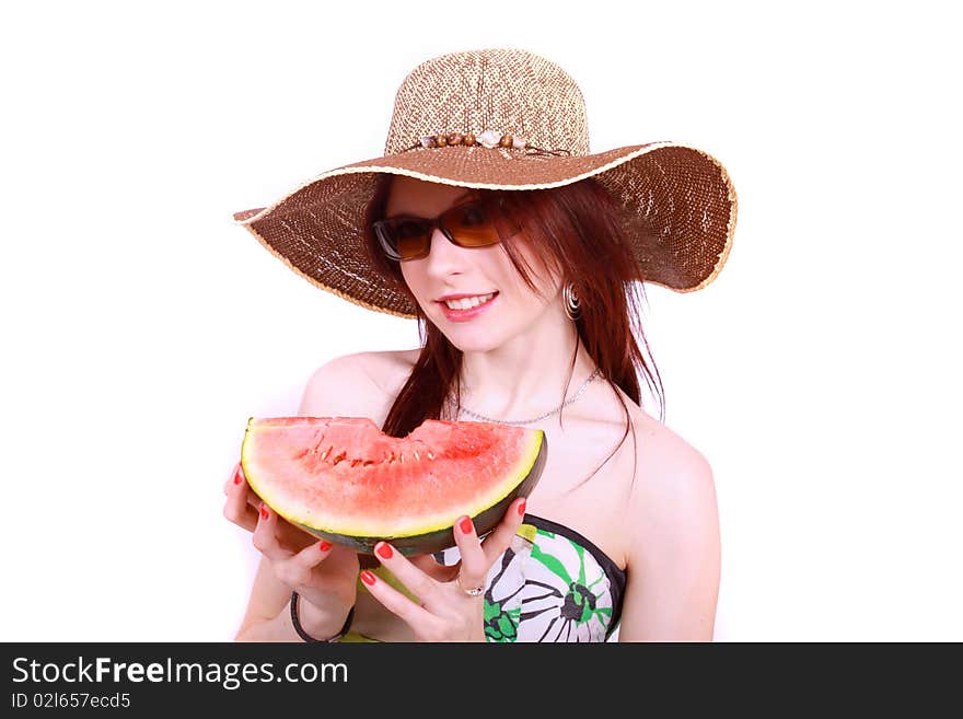 A beautiful woman wearing a hat and sunglasses, enjoying a sweet watermelon. A beautiful woman wearing a hat and sunglasses, enjoying a sweet watermelon.