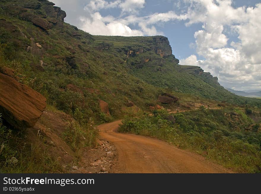 Dusty Road in a mountain landscape.