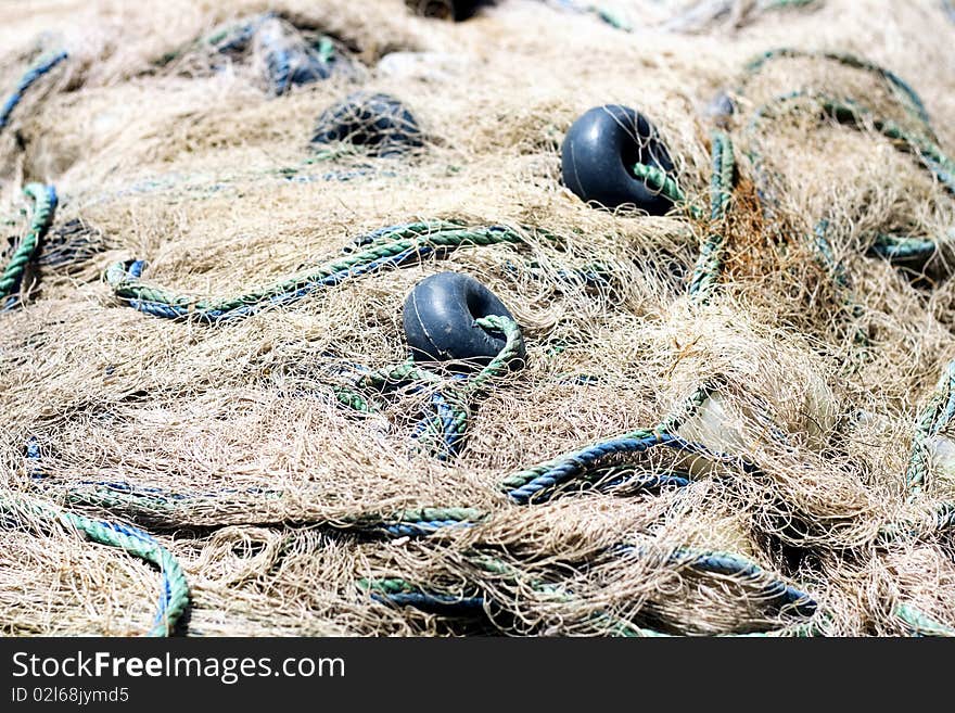 Fishing net spread on ground