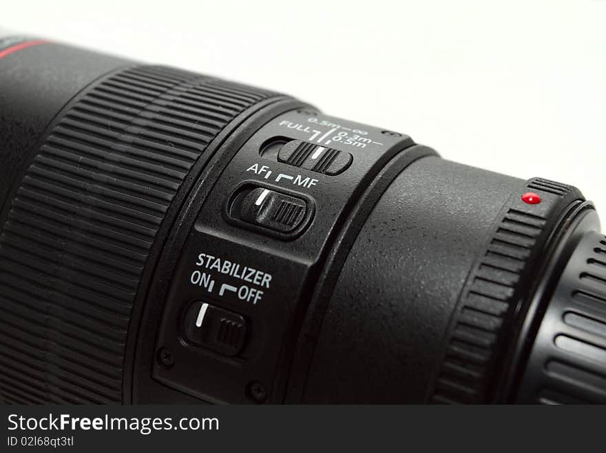 A professional 100mm macro lens isolated on a white background. A professional 100mm macro lens isolated on a white background