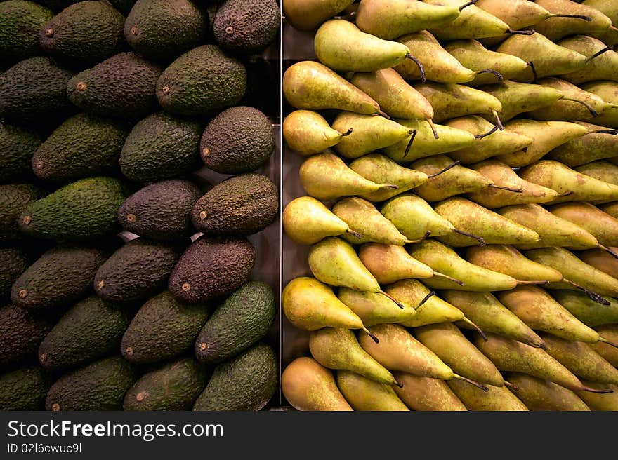 Containers with avocados and pears