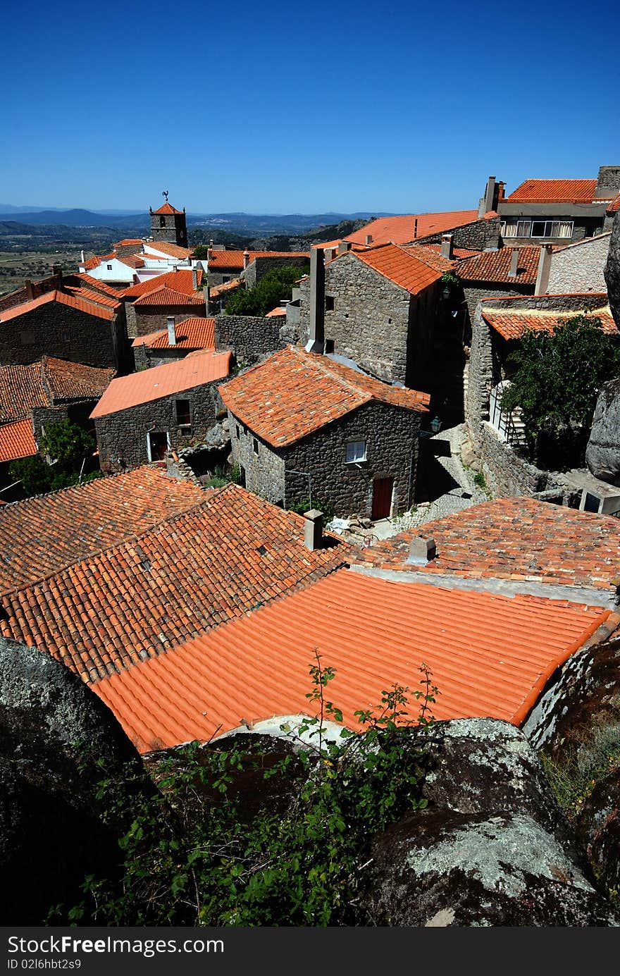 Stone village with red roofs