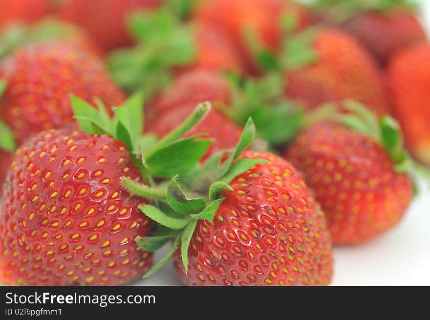 Fresh ripe red strawberries, isolated on white with soft shadow