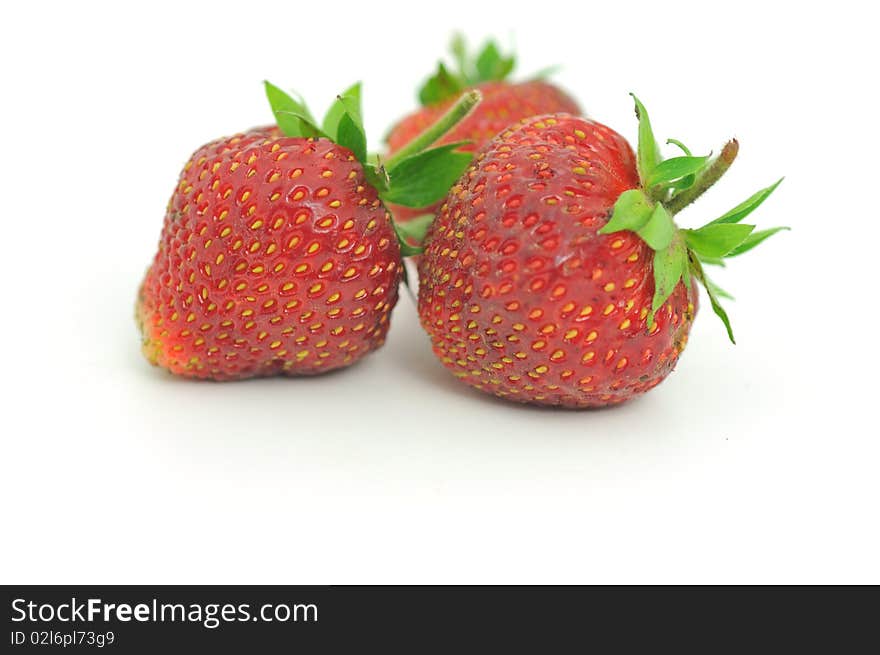 Fresh ripe red strawberries, isolated on white with soft shadow