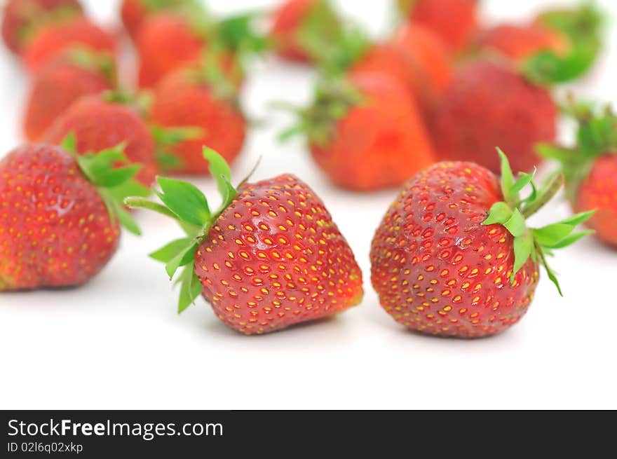 Fresh ripe red strawberries, isolated on white with soft shadow