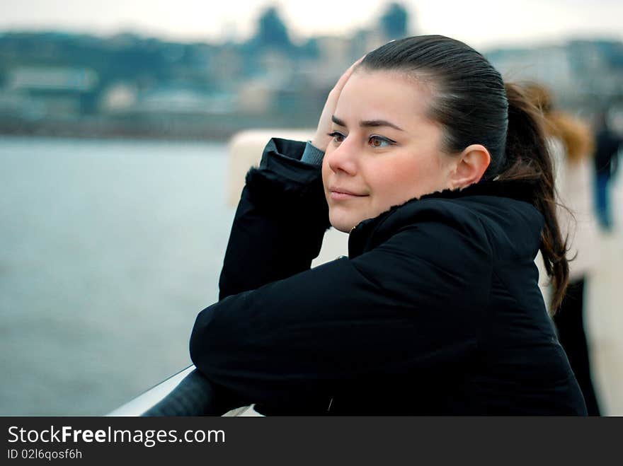 Cute girl looking at the sea. Cute girl looking at the sea