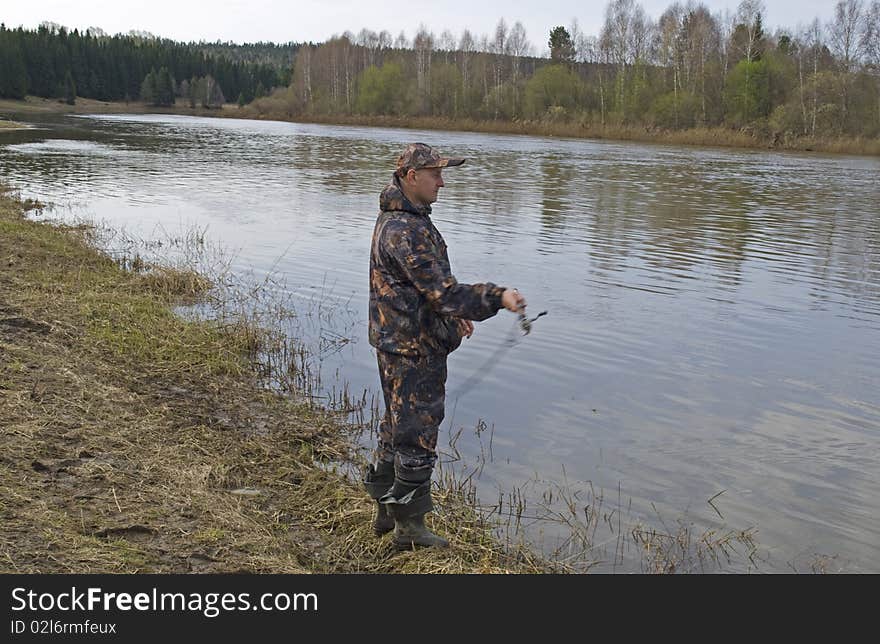 Photo of the fisherman on the river