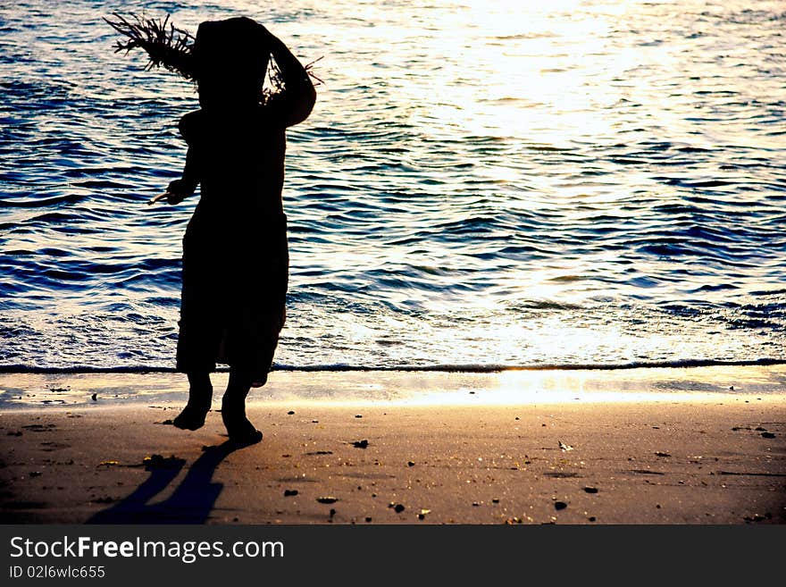 Kid silhouette on sea background