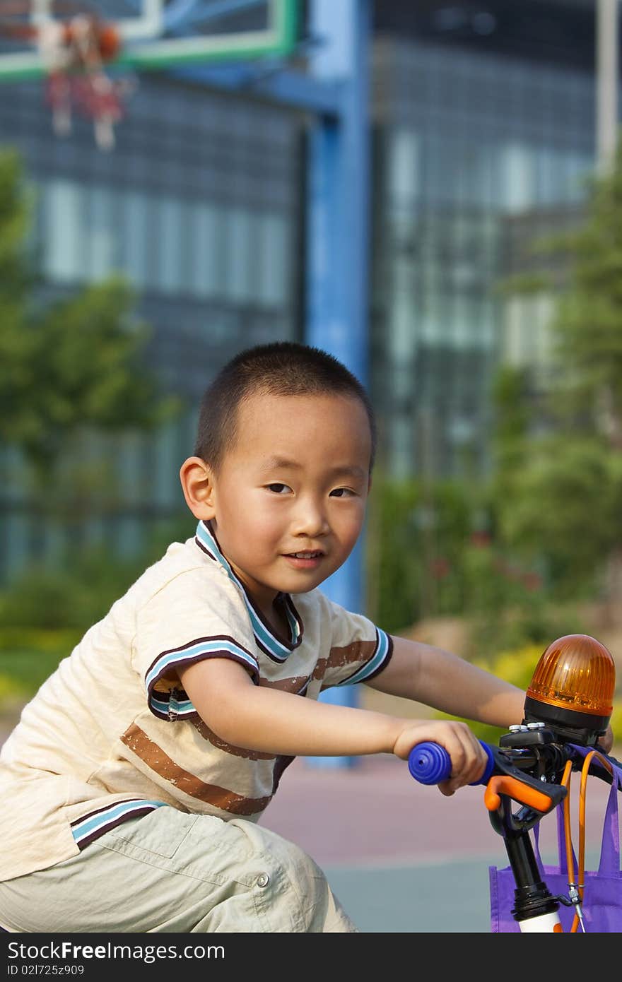 Asian boy riding