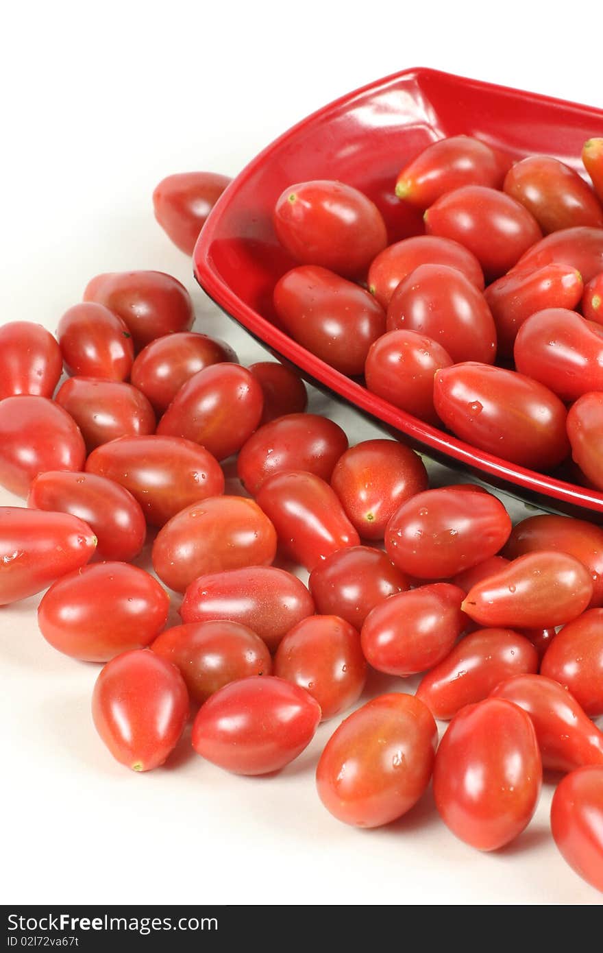 Small tomato on red plate