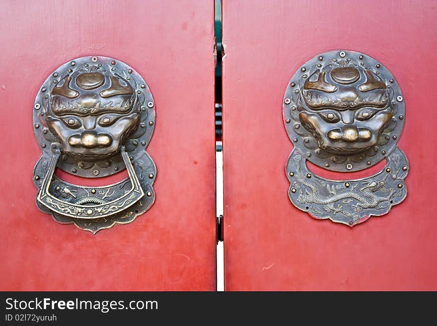 Red door in hutong area, close to Forbidden City, Beijing, China