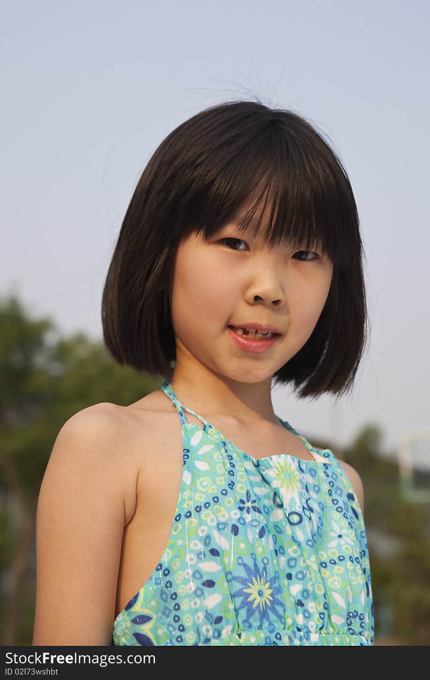 The outdoor portrait of an asian girl