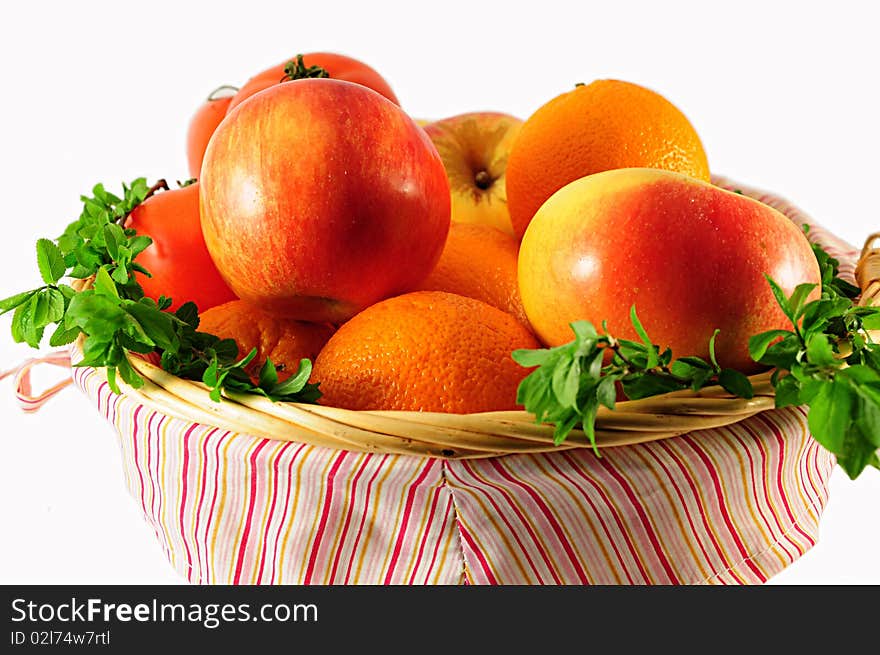 Fruits with leaves in basket. Fruits with leaves in basket