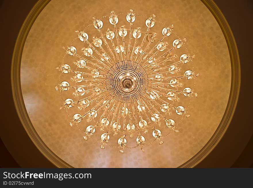 Looking up at a chandelier from below