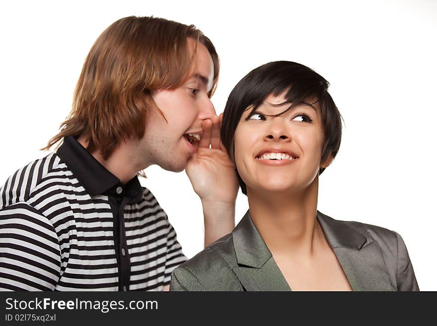 Attractive Diverse Couple Whispering Secrets Isolated on a White Background.