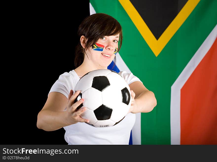 South africa world cup supporter, young female with flags on her cheeks and big south africa flag as background, studio shoot. South africa world cup supporter, young female with flags on her cheeks and big south africa flag as background, studio shoot