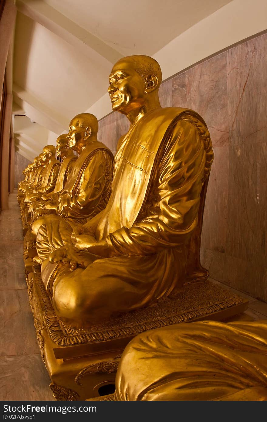 Gold metal statue in the thai temple