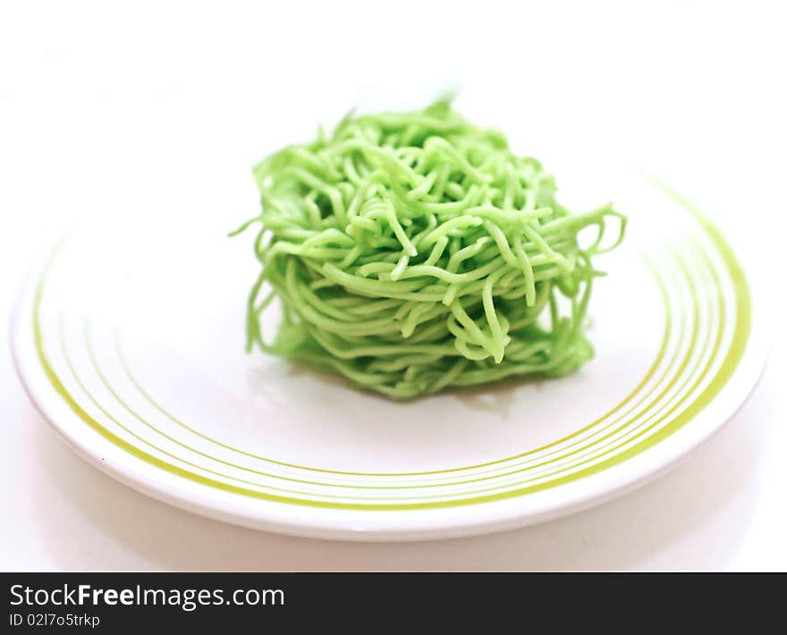 Egg noodles photograph on white dish in the morning