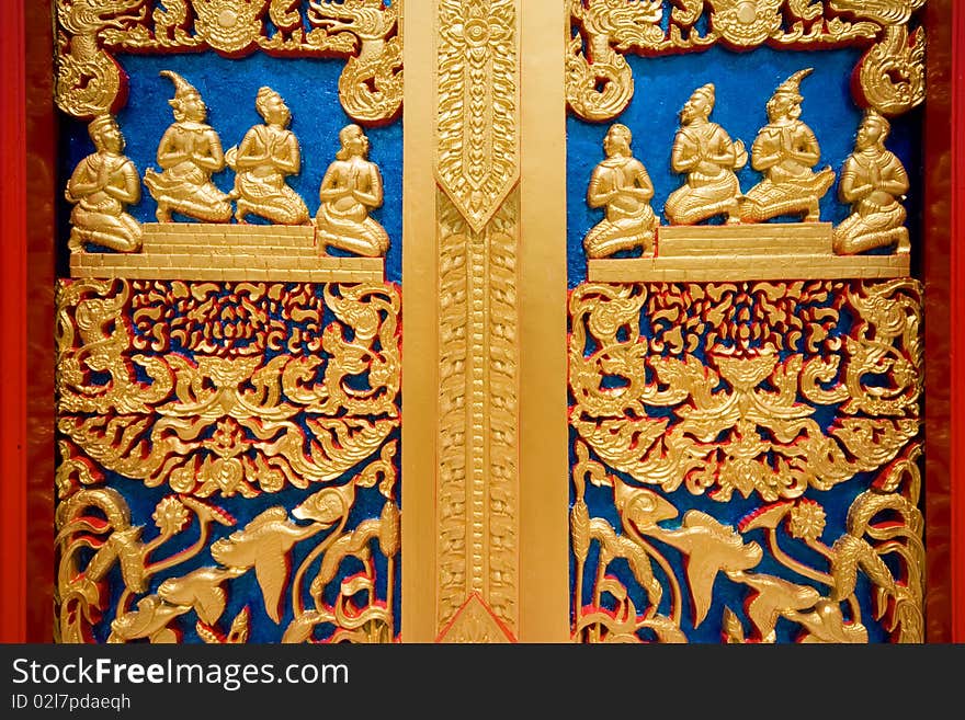 Thai painting on a door at buddhist church of Rayong Thailand