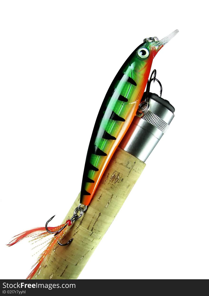 Fishing bait - wobbler on the handle spinning on an isolated white background. Fishing bait - wobbler on the handle spinning on an isolated white background