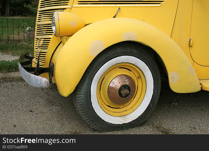 Classic old yellow sedan