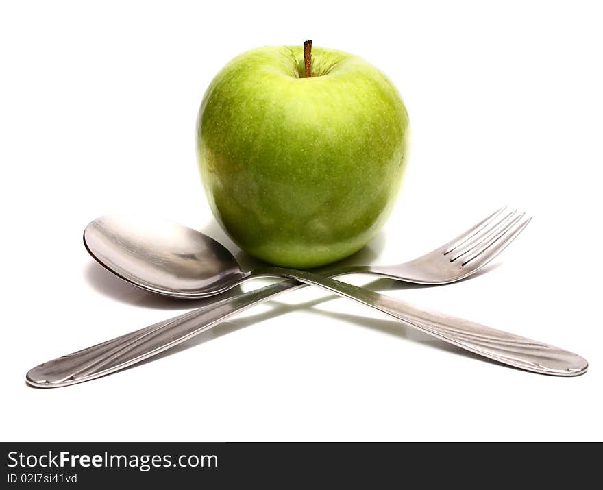 Spoon fork and green apple for diet