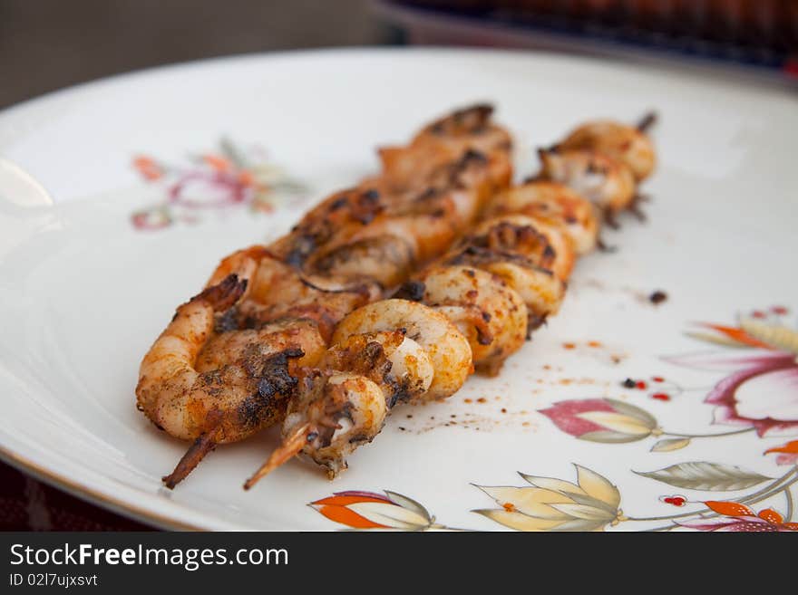 Tasty grilled fresh shrimps on a plate. Tasty grilled fresh shrimps on a plate