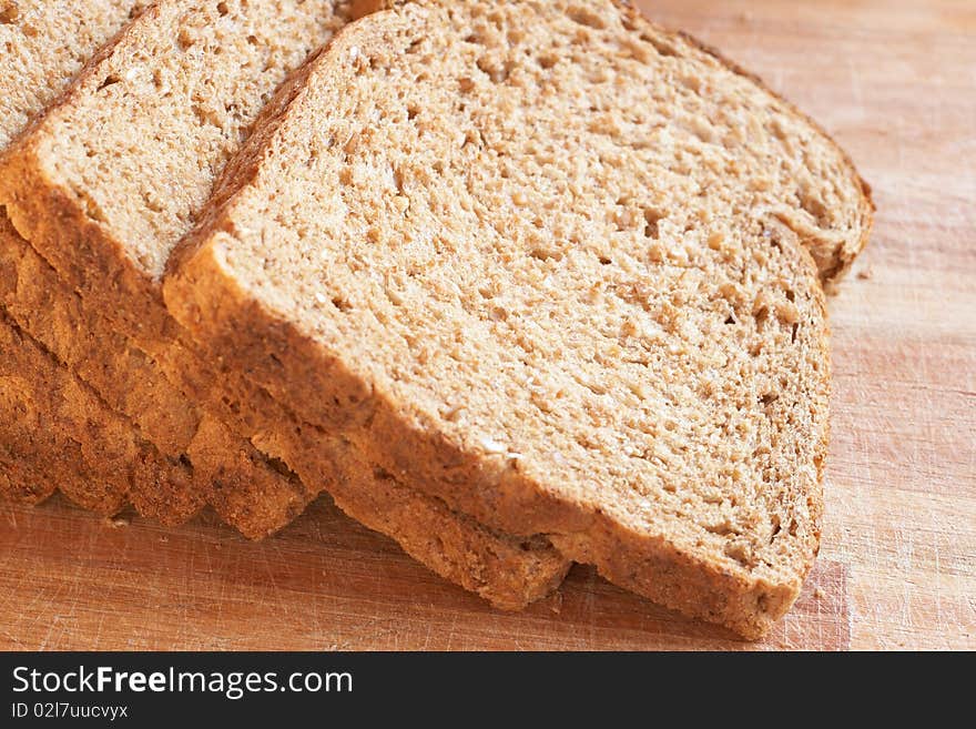 Slices of tasty healthy wholewheat bread on the table