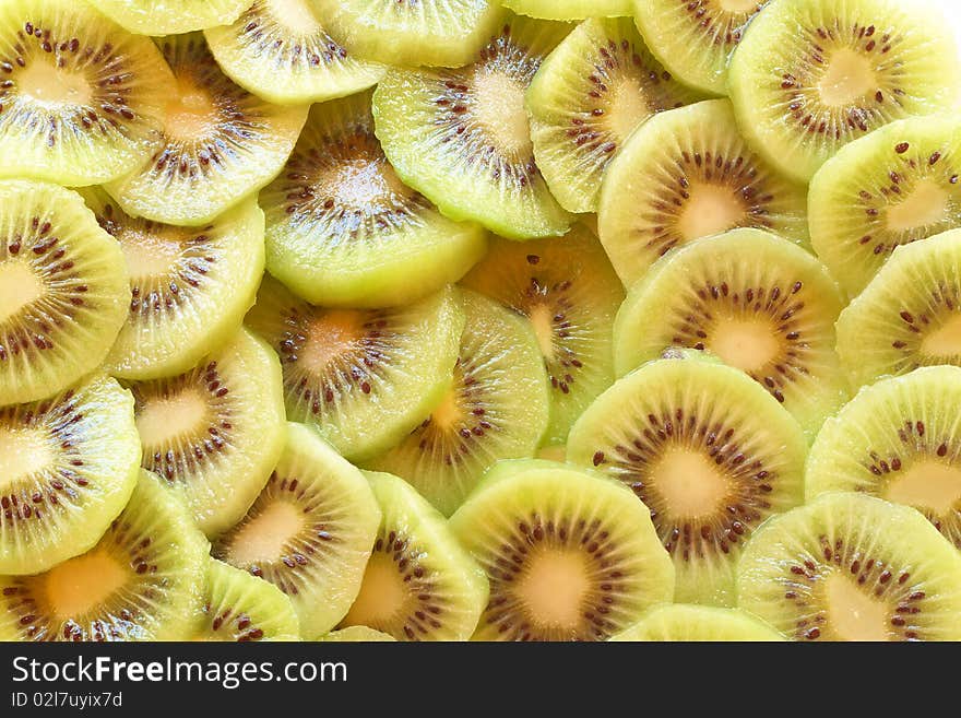 Green sliced kiwi fruit background