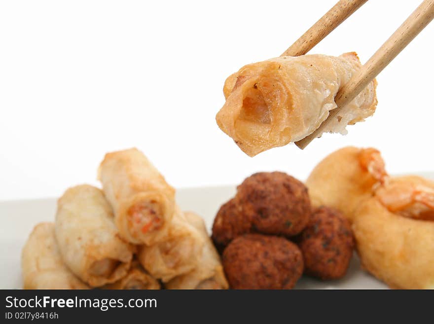 Isolated spring roll with chopsticks