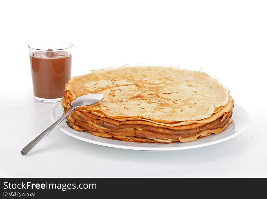 Pancakes with chocolate on white background