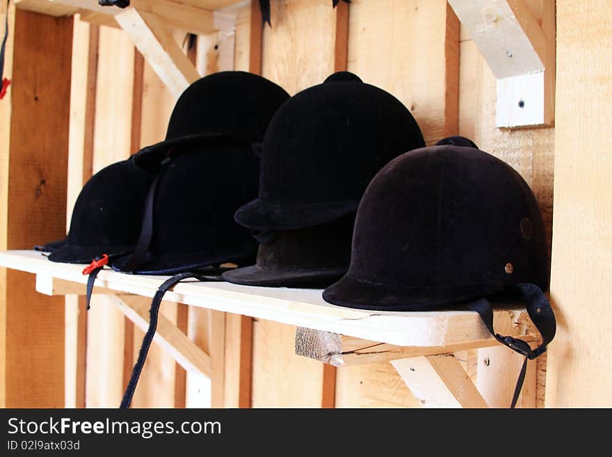 A collection of jockey hats used for competitions with horses!