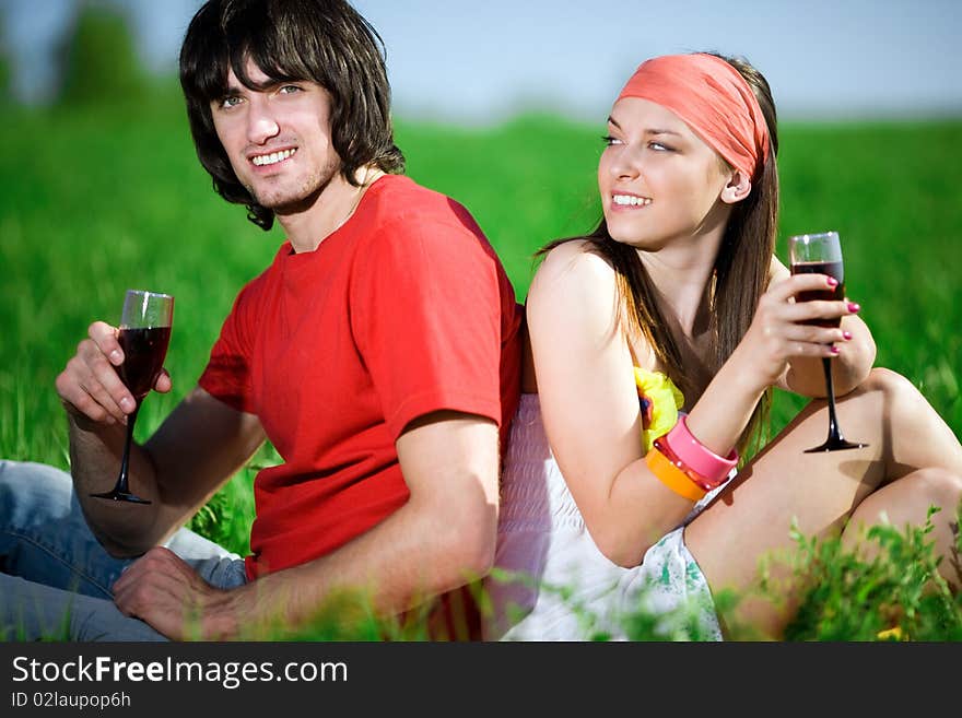 Boy and beautiful girl in kerchief with wineglasses. Boy and beautiful girl in kerchief with wineglasses