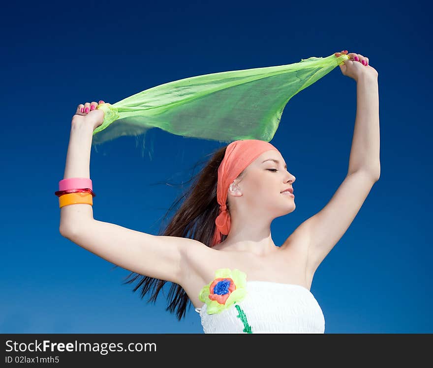 Girl With Kerchief On Blue Background