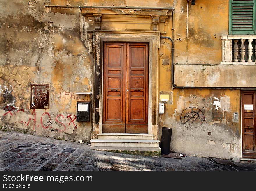 Detail of an ancient entrance door of an italian village. Detail of an ancient entrance door of an italian village