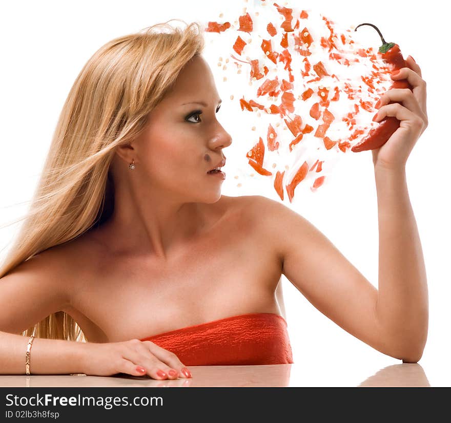 Pepper blows up in hands at the attractive woman. Pepper blows up in hands at the attractive woman