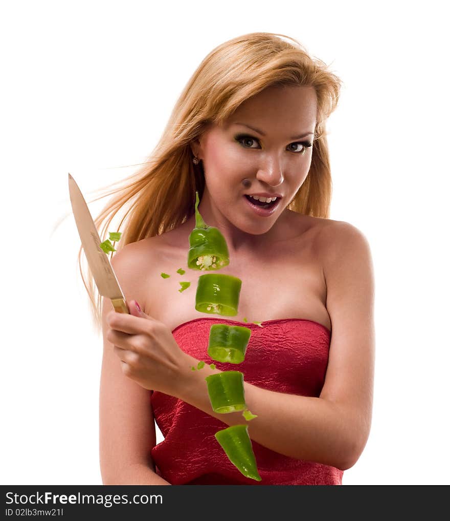 The woman cuts a pepper in air. The woman cuts a pepper in air