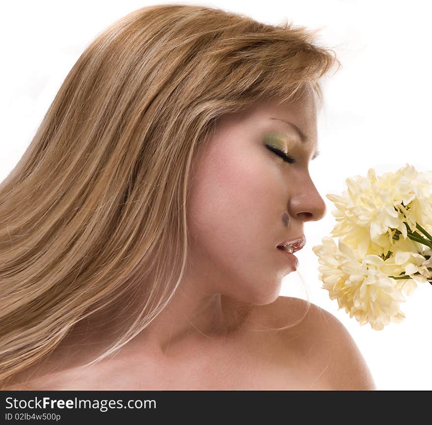 The beautiful women with a yellow flower. The beautiful women with a yellow flower