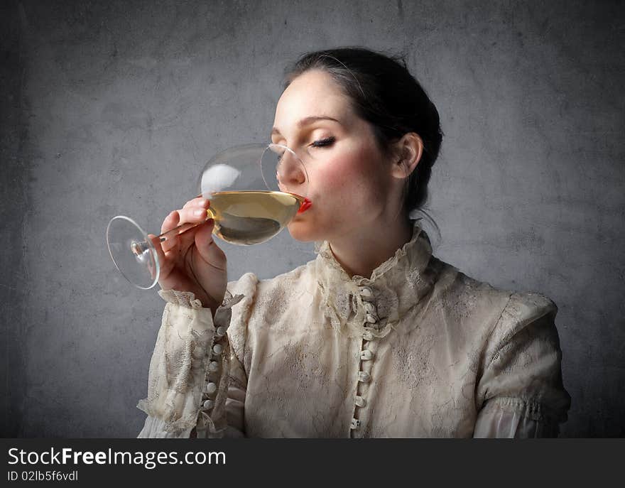 Beautiful woman drinking a glass of wine