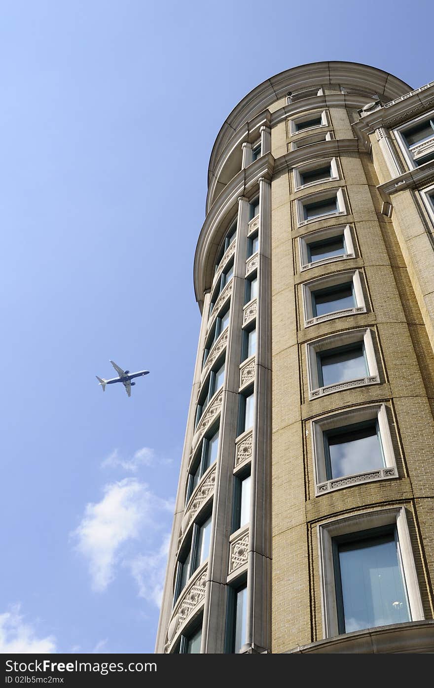 Airplane and vertical building